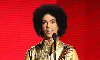 FILE - In this Nov. 22, 2015 file photo, Prince presents the award for favorite album - soul/R&B at the American Music Awards in Los Angeles. A famous bassist and longtime friend of pop megastar Prince says the artist found real happiness in his faith and could stay up all night talking about the Bible. Larry Graham tells The Associated Press that Prince became a Jehovahs Witness later in life and that it changed the stars music and lifestyle. (Photo by Matt Sayles/Invision/AP, File)