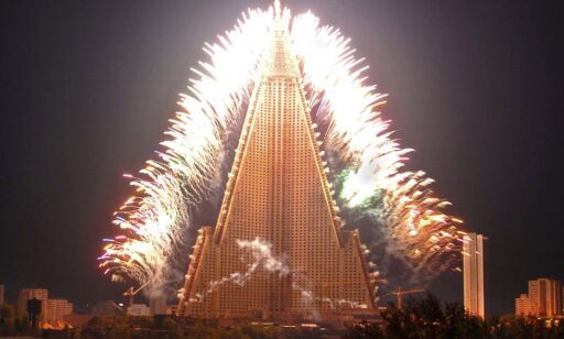 Fireworks are set off around the 105-storey Ryugyong Hotel to celebrate the May Day anniversary near the Botong River in Pyongyang May 1, 2009 in this picture released by North Korea's KCNA news agency on May 2, 2009. REUTERS/KCNA (NORTH KOREA POLITICS) QUALITY FROM SOURCE. NO THIRD PARTY SALES. NOT FOR USE BY REUTERS THIRD PARTY DISTRIBUTORS