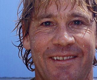 Bindi Irwin, daughter of Australian environmentalist and television personality Steve Irwin, reads out a speech about her father at a memorial service for him at Australia Zoo in Beerwah, Australia September 20, 2006. A khaki-clad choir, Hollywood stars and thousands of ordinary Australians bid farewell to "Crocodile Hunter" Steve Irwin at a memorial service for the TV naturalist at his "Crocoseum" on Wednesday. The service, broadcast live around Australia as well as across Asia and the United States, brought the nation to a standstill 16 days after Irwin was killed when the serrated barb from a stingray's tail pierced his heart. REUTERS/Steve Holland/Pool (AUSTRALIA)